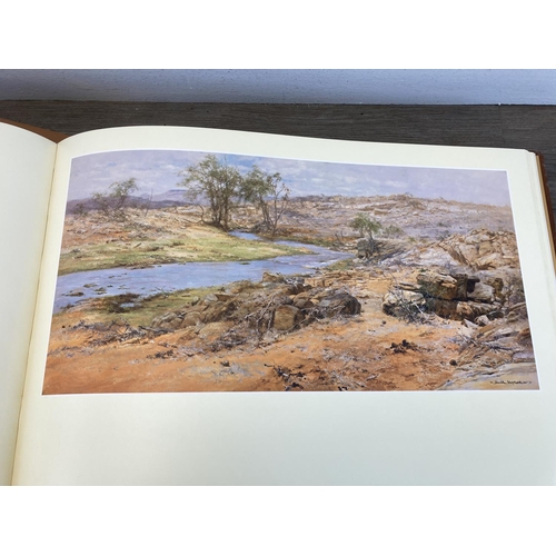 529 - A limited edition 453/506 hand signed David Shepherd Paintings of Africa and India leather bound boo... 