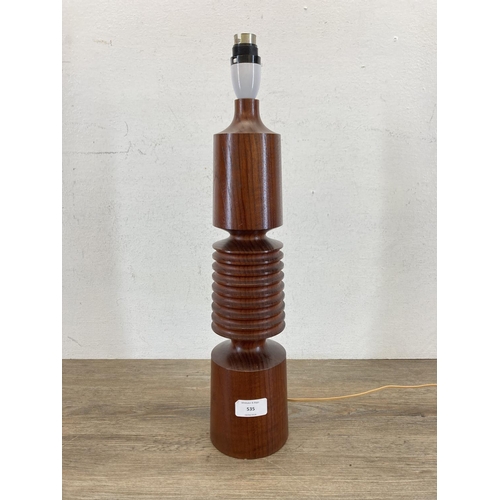 535 - A mid 20th century turned teak table lamp - approx. 41cm high (excluding bulb holder and shade)