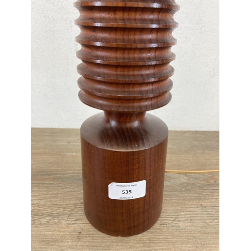 535 - A mid 20th century turned teak table lamp - approx. 41cm high (excluding bulb holder and shade)