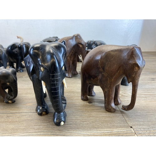 548 - A collection of approx. forty carved wooden and soapstone elephant figurines