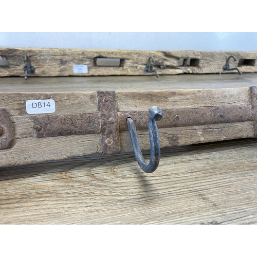 550 - Two rustic metal and wrought iron wall hanging coat hooks - largest approx. 116cm long