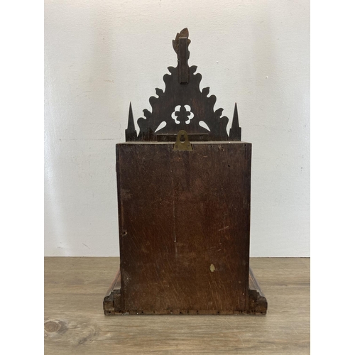 554 - A 19th century Gothic Revival oak cased fusee mantel clock with pendulum and key - approx. 61cm high... 