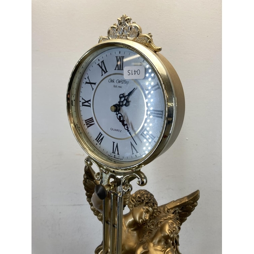 556 - A vintage W.M.Widdop gold painted figural mantle clock - approx. 75cm high