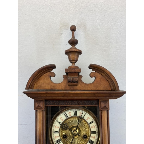 561 - An early 20th century German Berliner carved walnut chiming wall clock - approx. 83cm high x 23cm wi... 