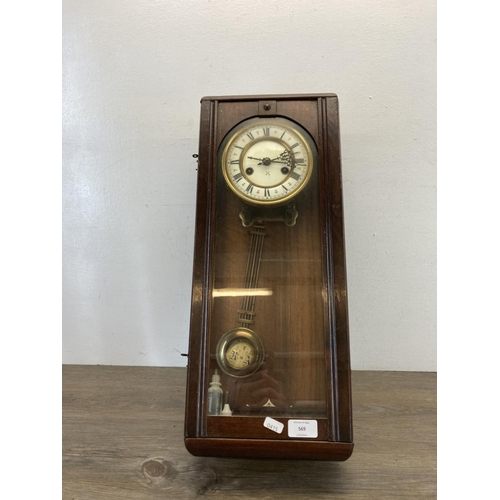 569 - An early/mid 20th century mahogany cased wall clock - approx. 55cm high x 22cm wide