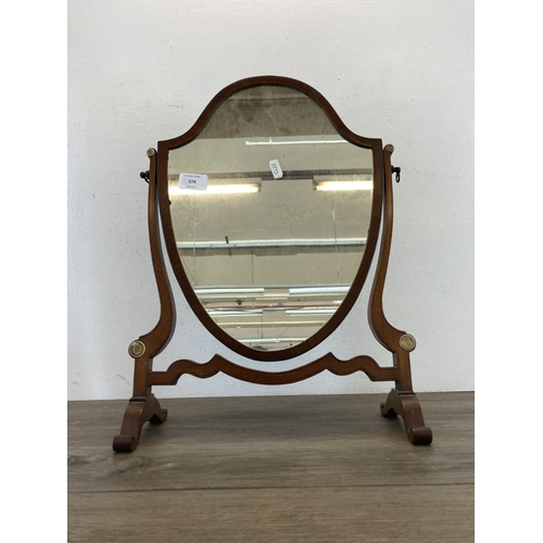 574 - An Edwardian mahogany shield shaped bathroom swing mirror - approx. 49cm high x 34cm wide