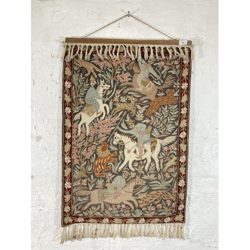 582 - A vintage hand embroidered Persian hunting scene tapestry - approx. 90cm high x 61cm wide