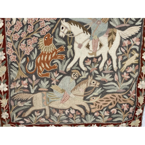 582 - A vintage hand embroidered Persian hunting scene tapestry - approx. 90cm high x 61cm wide