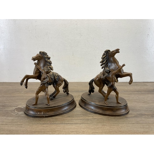 587 - A pair of bronzed spelter rearing horse figurines - approx. 22cm high