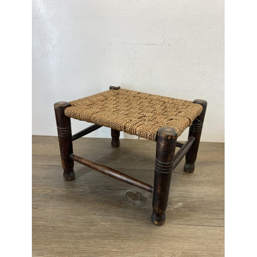 594 - Two early 20th century oak and rush seated footstools - largest approx. 23cm high x 32cm wide x 27cm... 