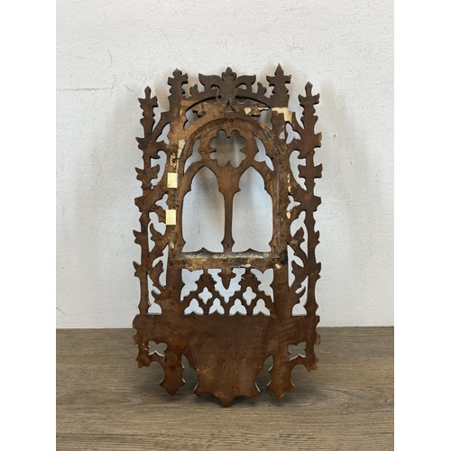 599 - A 19th century Gothic Revival carved wooden wall hanging plaque with lower shelf - approx. 40cm high... 