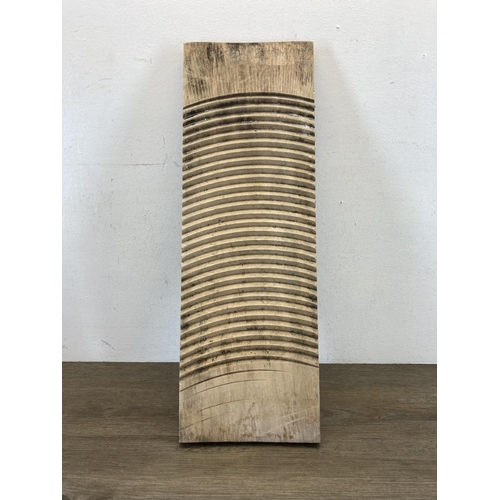 601 - A 19th century pine washboard - approx. 56cm high x 19cm wide