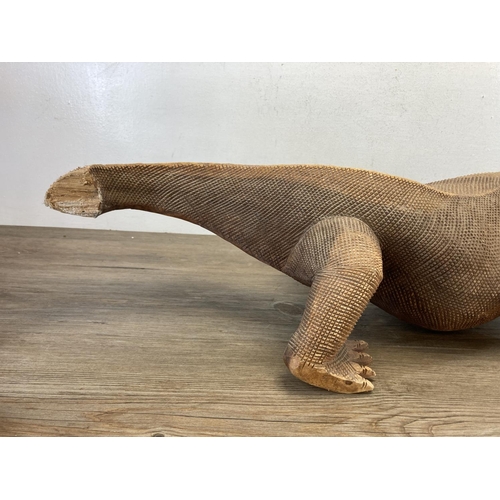 602 - A large hand carved hardwood Komodo dragon figurine - approx. 91cm long