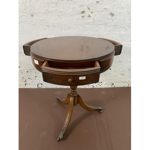 102 - A Regency style mahogany drum table - approx. 63cm high x 50cm diameter