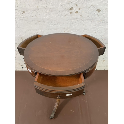 102 - A Regency style mahogany drum table - approx. 63cm high x 50cm diameter