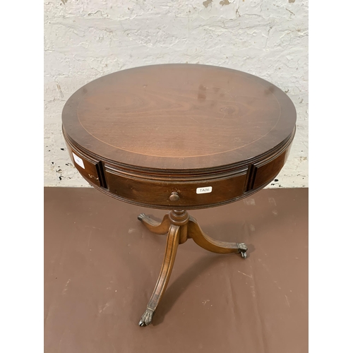 102 - A Regency style mahogany drum table - approx. 63cm high x 50cm diameter