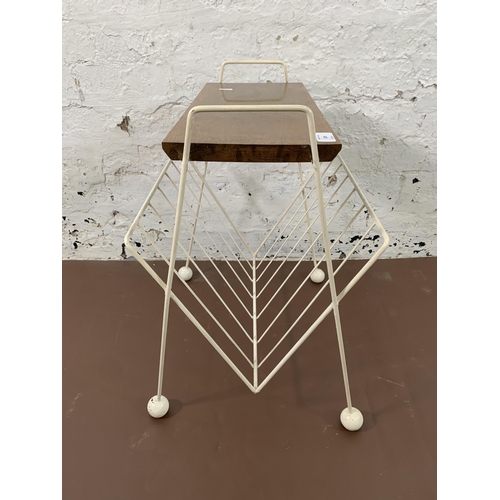 105 - A mid 20th century white painted metal and teak atomic sputnik magazine rack side table - approx. 55... 