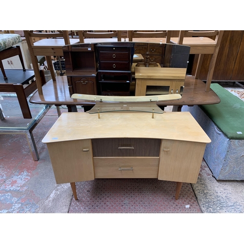 107 - A mid 20th century Lebus oak and walnut effect dressing table - approx. 124cm high x 112cm wide x 45... 