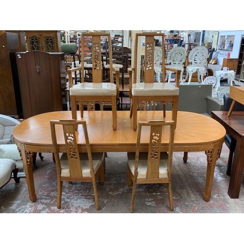 113 - An Oriental carved hardwood extending dining table and six chairs - approx. 76cm high x 112cm wide x... 