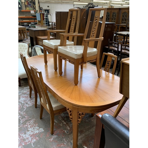 113 - An Oriental carved hardwood extending dining table and six chairs - approx. 76cm high x 112cm wide x... 