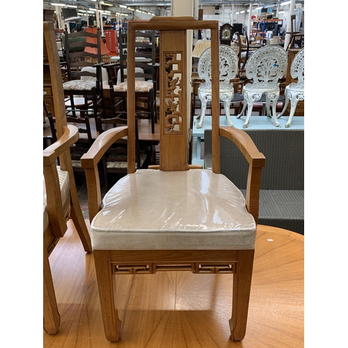 113 - An Oriental carved hardwood extending dining table and six chairs - approx. 76cm high x 112cm wide x... 