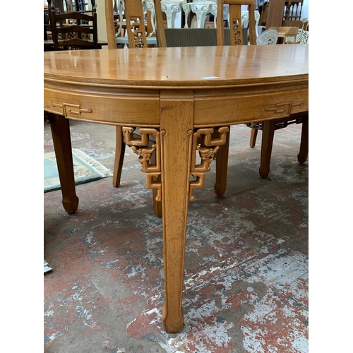 113 - An Oriental carved hardwood extending dining table and six chairs - approx. 76cm high x 112cm wide x... 