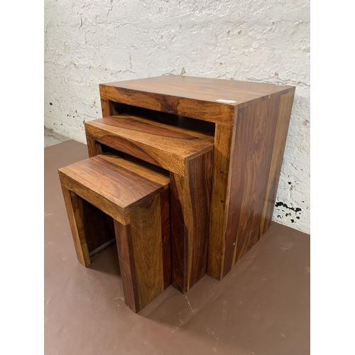 117 - An Indian sheesham wood nest of tables - approx. 45cm high x 44cm wide x 30cm deep