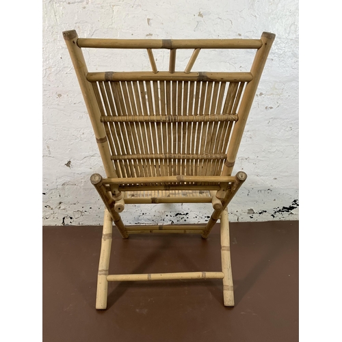 119 - A pair of bamboo folding chairs