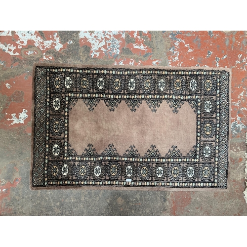 122 - Three rugs, one G.H.Frith Ltd. Pakistan Bokhara Blue - approx. 91cm x 61cm, one Frith Rugs Pakistan ... 