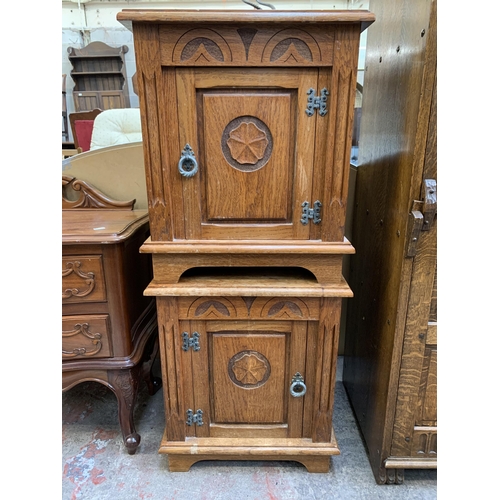 124 - A pair of 17th century style carved oak bedside cabinets - approx. 53cm high x 46cm wide x 39cm deep