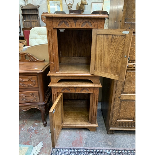 124 - A pair of 17th century style carved oak bedside cabinets - approx. 53cm high x 46cm wide x 39cm deep