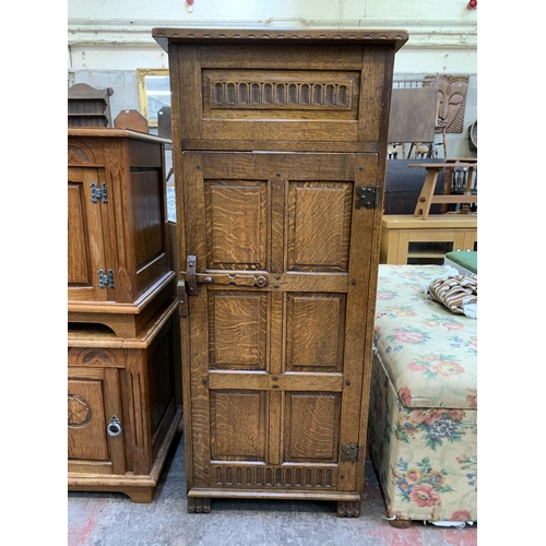 125 - A 17th century style carved oak record cabinet - approx. 126cm high x 54cm wide x 48cm deep