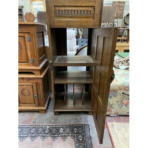 125 - A 17th century style carved oak record cabinet - approx. 126cm high x 54cm wide x 48cm deep