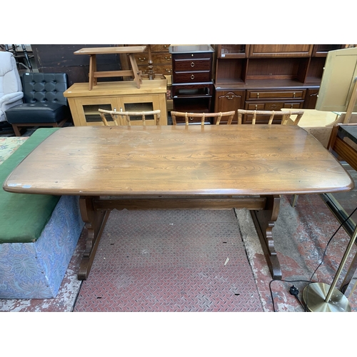 128 - An Ercol Golden Dawn elm dining table - approx. 72cm high x 87cm wide x 182cm long