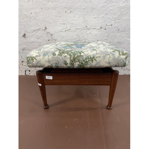 130 - A mid 20th century teak storage footstool with Morris & Co. upholstery - approx. 36cm high x 52cm wi... 