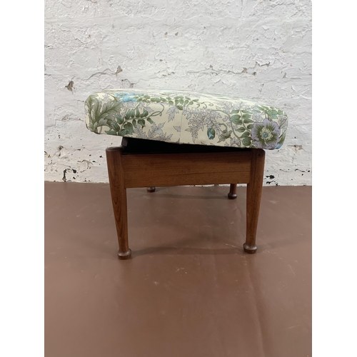 130 - A mid 20th century teak storage footstool with Morris & Co. upholstery - approx. 36cm high x 52cm wi... 