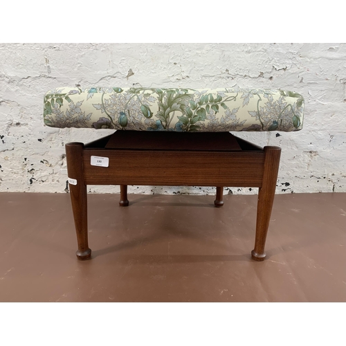 130 - A mid 20th century teak storage footstool with Morris & Co. upholstery - approx. 36cm high x 52cm wi... 