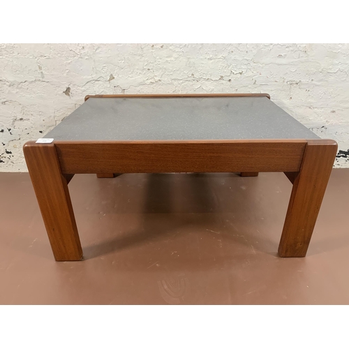 131 - A mid 20th century teak and black laminate rectangular coffee table - approx. 40cm high x 55cm wide ... 