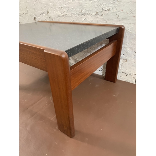 131 - A mid 20th century teak and black laminate rectangular coffee table - approx. 40cm high x 55cm wide ... 