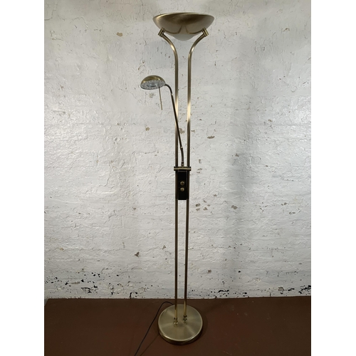 135 - A modern brass effect uplighter floor lamp - approx. 183cm high