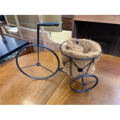 136 - Three wrought metal tricycle garden planters - largest approx. 41cm high x 67cm long