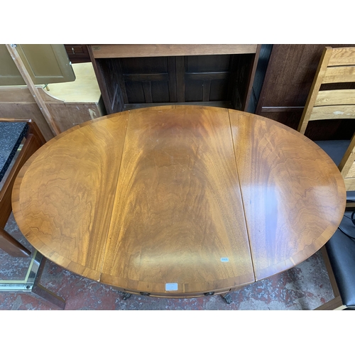 137 - A Regency style yew wood oval drop leaf pedestal breakfast table - approx. 78cm high x 94cm wide x 1... 