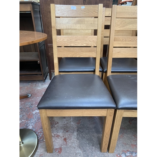 138 - Six modern oak and brown leatherette dining chairs