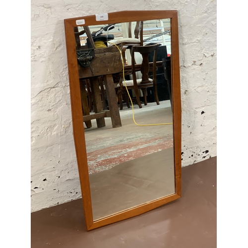 140 - A mid 20th century teak framed wall mirror - approx. 68cm high x 40cm wide