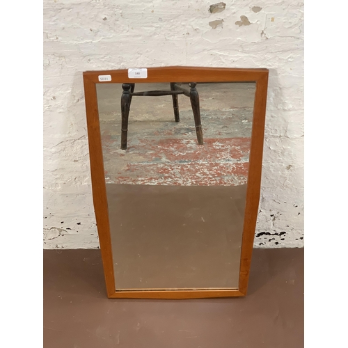 140 - A mid 20th century teak framed wall mirror - approx. 68cm high x 40cm wide