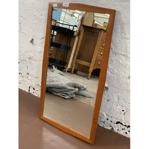 140 - A mid 20th century teak framed wall mirror - approx. 68cm high x 40cm wide