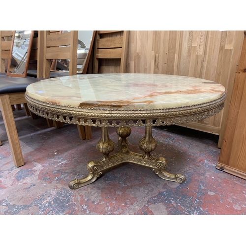 143 - A Rococo style onyx and gilt metal circular tripod coffee table - approx. 50cm high x 90cm diameter