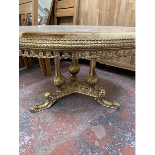 143 - A Rococo style onyx and gilt metal circular tripod coffee table - approx. 50cm high x 90cm diameter