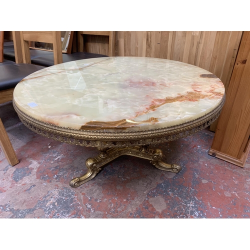 143 - A Rococo style onyx and gilt metal circular tripod coffee table - approx. 50cm high x 90cm diameter