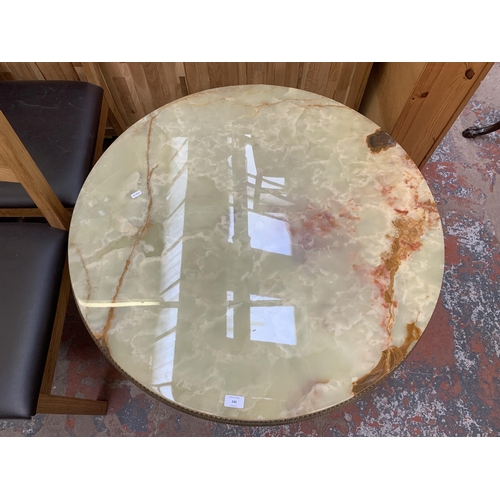 143 - A Rococo style onyx and gilt metal circular tripod coffee table - approx. 50cm high x 90cm diameter